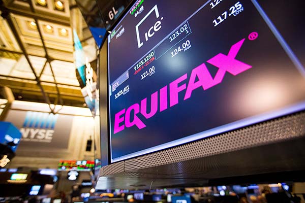 NYSE trading floor with Equifax on screen
